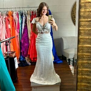 Elegant Ivory Gown with Intricate Details and blue beading